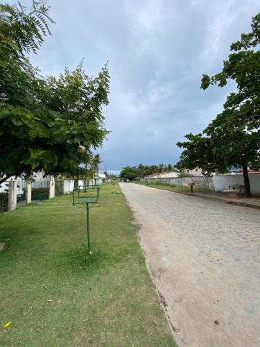 a road with trees on the side of the road at Flat por temporada in São José da Coroa Grande