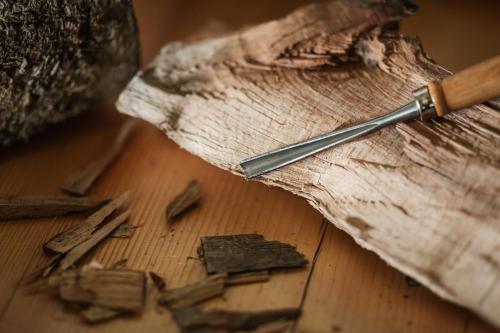 a knife sitting on top of a wooden table at Atelier Recreation Village in Râşnov