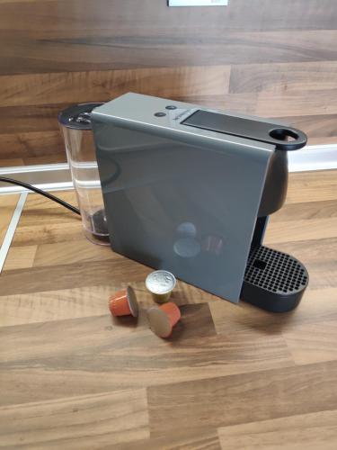a sewing machine sitting on a wooden floor at Апартамент Relax in Smolyan