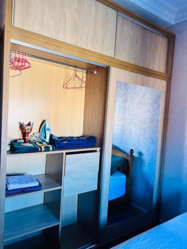 a room with a mirror and a bunk bed at Julie's Private Apartment in Marrakech