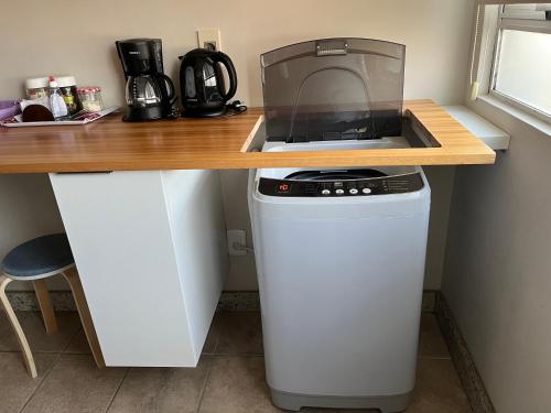 Dapur atau dapur kecil di Conforto e simplicidade no centro da cidade