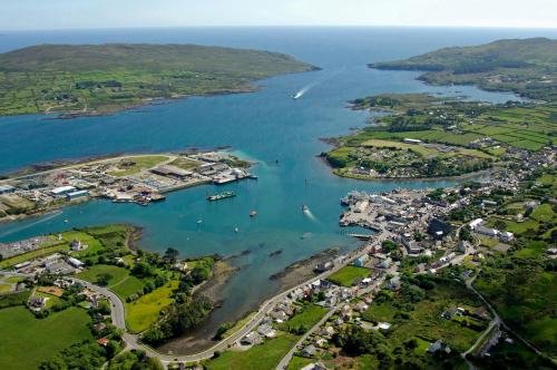 an aerial view of a harbor with boats in the water at A house and a half on Beara peninsula in Castletownbere