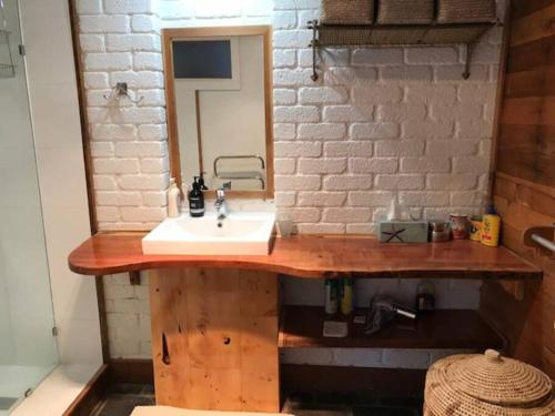 a bathroom with a sink and a mirror at The Stone Cottage - Bruny Island in Simpsons Bay
