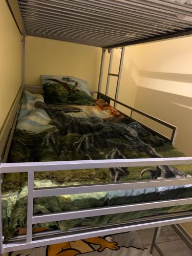 a bunk bed in a small room with a bed at Gite Equestre Drôme des Collines in Claveyson