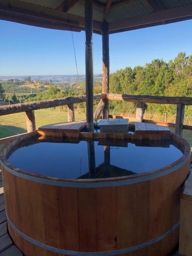 a large wooden hot tub on a wooden deck at Terrazas altos de Gamboa in Castro