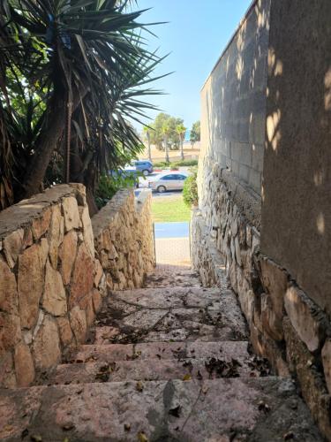 an alley between a stone wall at SEA VIEW ASHDOD in Ashdod