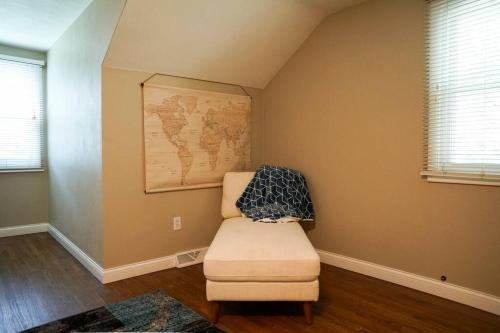 a room with a chair and a map on the wall at 4BR/2.5BA Home boasting 2400sqft and Eat-in KTN in Toledo
