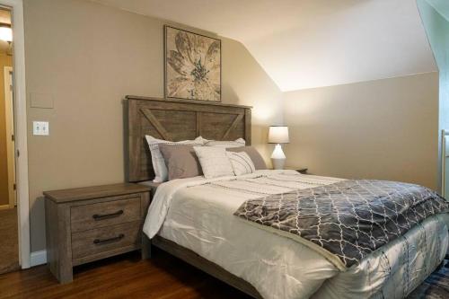 a bedroom with a large bed and a night stand at 4BR/2.5BA Home boasting 2400sqft and Eat-in KTN in Toledo