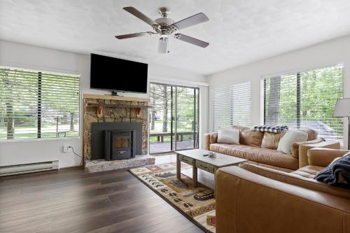 a living room with a couch and a fireplace at Charming Getaway l recently renovated l Hidden Valley l 4BR+3Bath l Hot Tub in Somerset