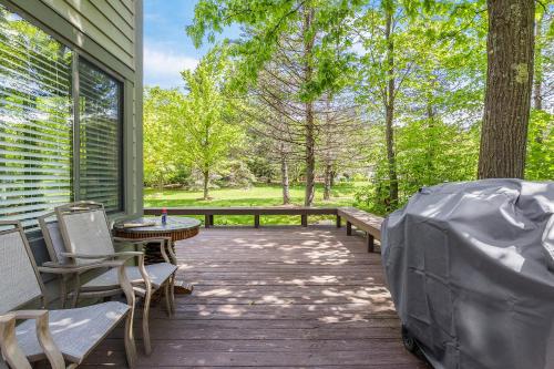 a porch with a bench and a table and chairs at Charming Getaway l recently renovated l Hidden Valley l 4BR+3Bath l Hot Tub in Somerset