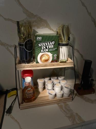 a shelf with a box of honey and cups of food at Prestige Collection, Hotel Boutique in St Petersburg