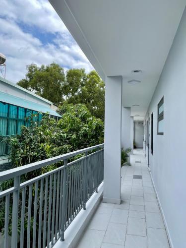 a corridor of a building with a balcony at Mango Villa Long Hải Beach in Long Hai