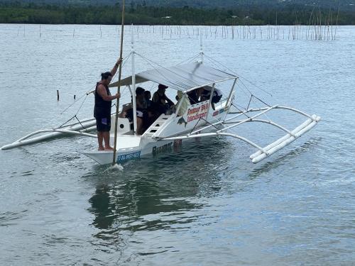 a group of people in a boat on the water at Casas de Ruumar Bed and Breakfast-Bar-Two rooms for family available in Clarin