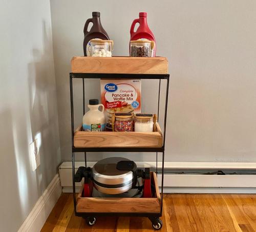 a shelf with food items on it in a kitchen at Cedar Mill Hideaway in Woodbury