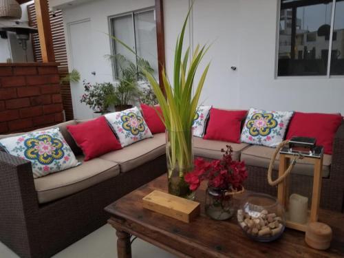 a living room with a couch and a coffee table at MALU HOUSE - PERU - Lima in Lima