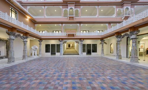 an empty hall with an elephant in the middle at Fateh Vilas by Fateh Collection in Udaipur