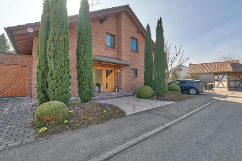 a house with trees in front of a driveway at Ersfeld - Bad Teinach Zavelstein in Bad Teinach-Zavelstein