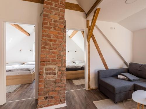 a living room with a couch and a bedroom at Zur Altstadt in Monschau