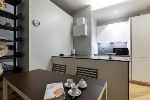Virtuvė arba virtuvėlė apgyvendinimo įstaigoje Contempora Apartments - Visconti di Modrone