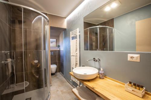 a bathroom with a shower and a sink and a toilet at La finestra sulla Torre in Siena