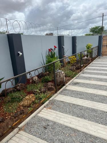 a set of stairs next to a building with plants at Home@Amalia’s in Rundu
