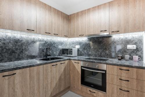 Kuchyňa alebo kuchynka v ubytovaní Iosifina Cosy Apartment