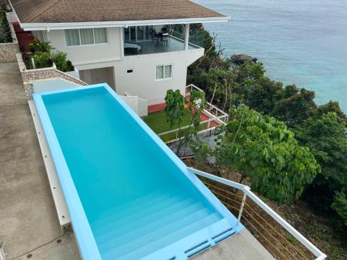 an overhead view of a blue slide on a balcony at Noor Villa - Luxury 3 Bed, 2 Bath Apartment with Stunning Panoramic Sea View, Private Beach in Pinamihagan
