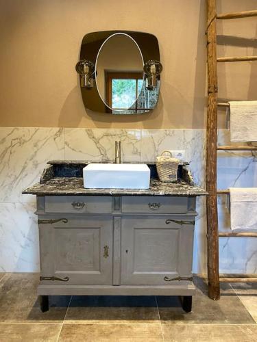 a bathroom with a sink and a mirror at Wohnung in Kirchberg in Tirol in Kirchberg in Tirol