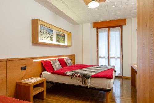 Postel nebo postele na pokoji v ubytování Hotel Biancospino