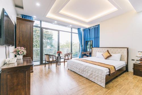 Giường trong phòng chung tại Villa FLC Sầm Sơn San Hô - Giáp Biển