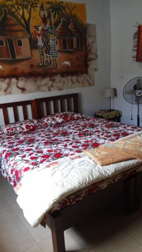 Кровать или кровати в номере Casa Hotel Sinkiling Gambia