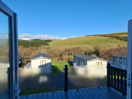 a view from the balcony of a house at Mawgan Pads Lazy Days Lodge in Mawgan Porth
