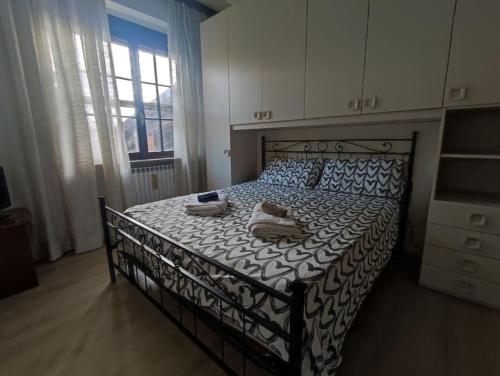 Ліжко або ліжка в номері La casa della Nonna