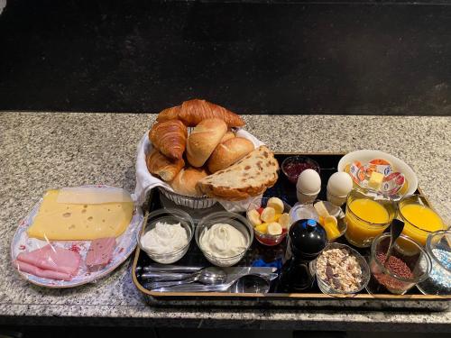 a tray of bread and other foods on a counter at B&B de Tol in Hulst