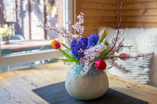 a vase with flowers in it on a table at Chatka Mileč in Nepomuk