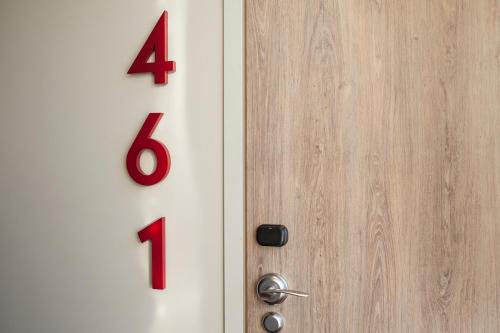 a door with a red number on it at Motel L Lund in Lund
