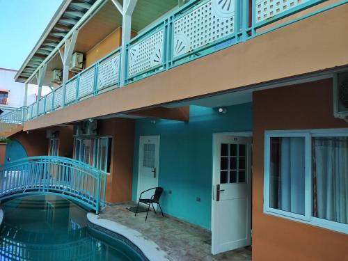 a house with a swimming pool and a balcony at Apt S4, Park View Terrace- Cozy Convenience! in Crown Point