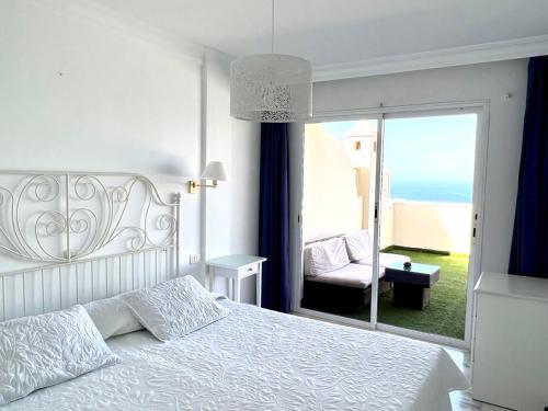 A bed or beds in a room at Buenavista Top Floor Penthouse