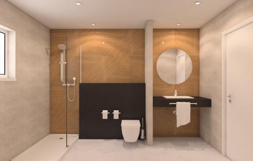 a bathroom with a toilet and a sink and a mirror at AP Adriana Beach Resort in Albufeira