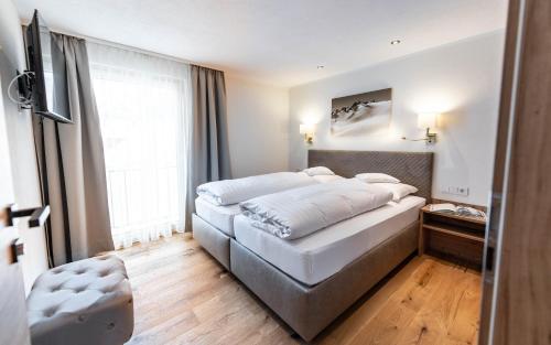 Postel nebo postele na pokoji v ubytování Appartements Eldorado