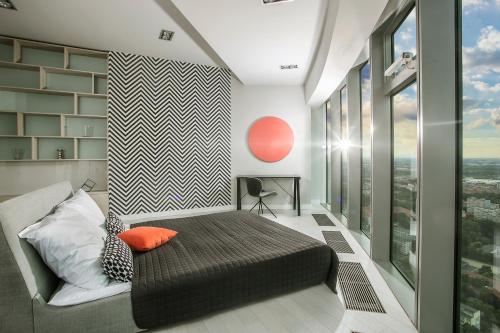 Postel nebo postele na pokoji v ubytování Apartamenty Sky Tower