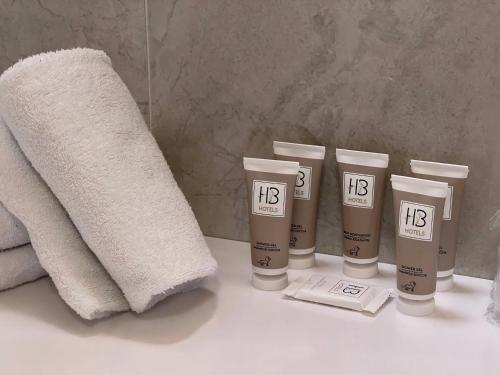 a group of fourige products sitting on a bathroom counter at Hotel Master in Brescia