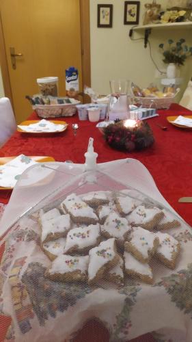 a table with a table cloth with a cake on it at La Pirata Capitana in Costa degli Angeli