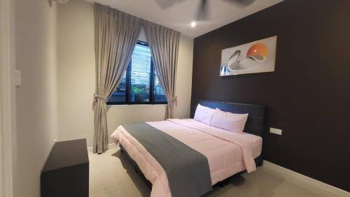 a bedroom with a large bed and a window at Fairy Retreat Pravite Pool Cottage - 10-12 pax in Ipoh
