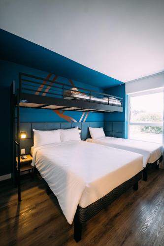 Una cama o camas en una habitación de ibis Styles Poços de Caldas