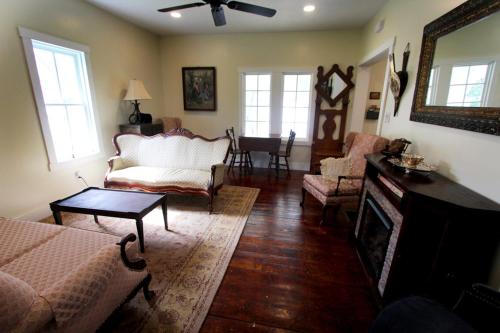 a living room with a couch and a fireplace at Cozy, historic 5-bedroom home in Amish country in Smicksburg