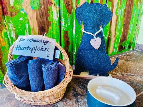 a basket of blue boots with a sign that says for sunrise kindergarten at Landhaus Hammoor Stieper Gastronomie GmbH in Hammoor