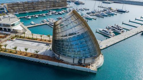 an aerial view of a building next to a marina at Tsokkos Paradise Holiday Village in Ayia Napa