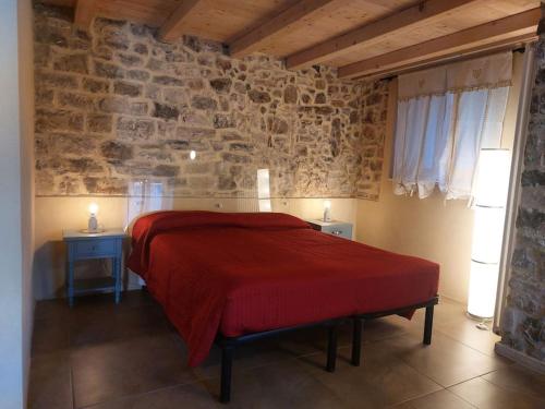Krevet ili kreveti u jedinici u okviru objekta La Casa del Sole a Cosy Nest in Lunigiana, Tuscany