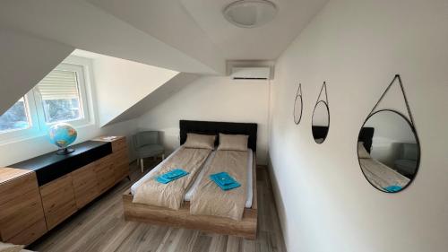 a bedroom with a bed and a mirror at Charlie&Blueberries in Belgrade